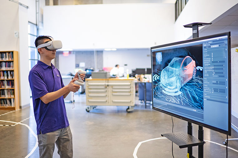 Student using VR system for research.