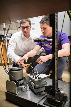 Bostwick and student in lab.