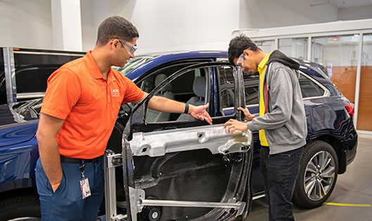 Graduate students working on door research at the Clemson Composite Center.