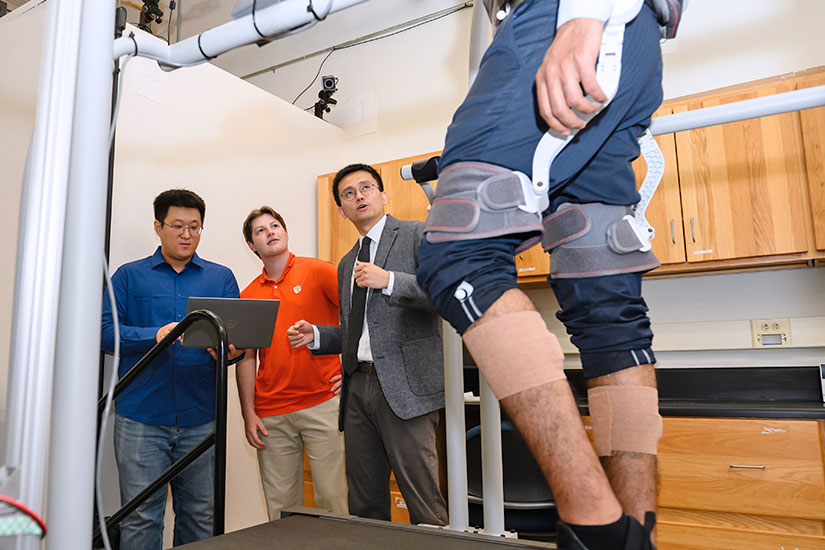 Student assisting faculty members with mobility research.
