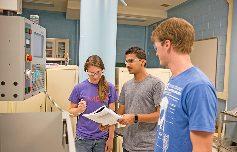 Three students in the Cook Engineering Lab.