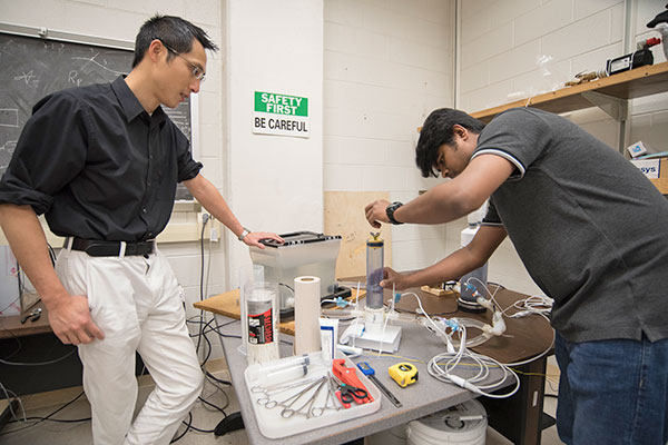 Kung and student in lab