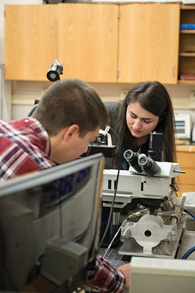 Pataky in lab with student