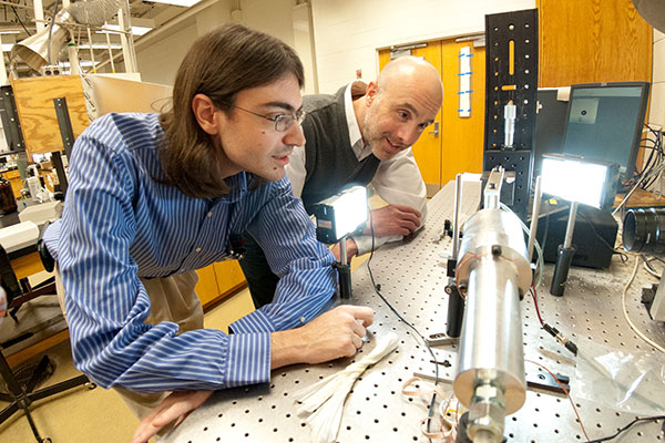 Saylor and student in lab