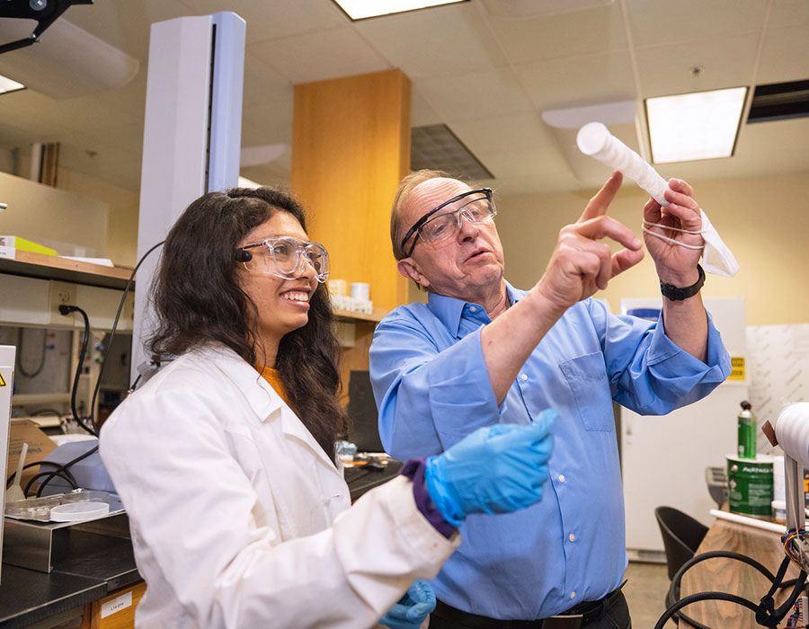 Female graduate student in lab with Urban