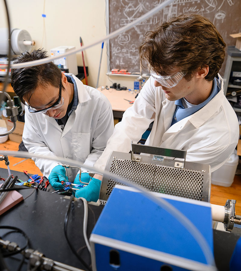 Two students in Professor Joshua Tong's lab in AMIC.