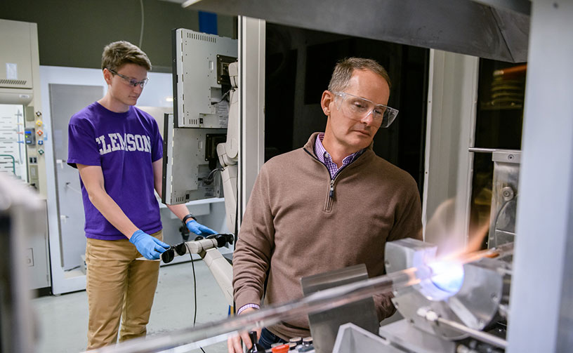 Ballato in lab with student
