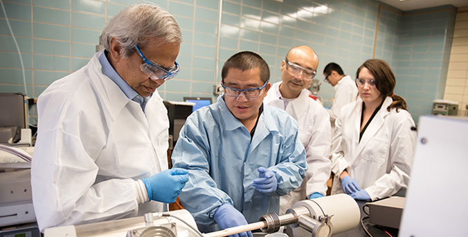 Bordia in lab with research group