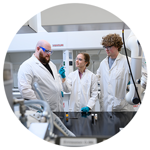 Fulbright Scholar Merle Wellmann (center) works in an AMIC lab with fellow Ph.D. students Peyton McGuire (left) and Josh Willoughby.
