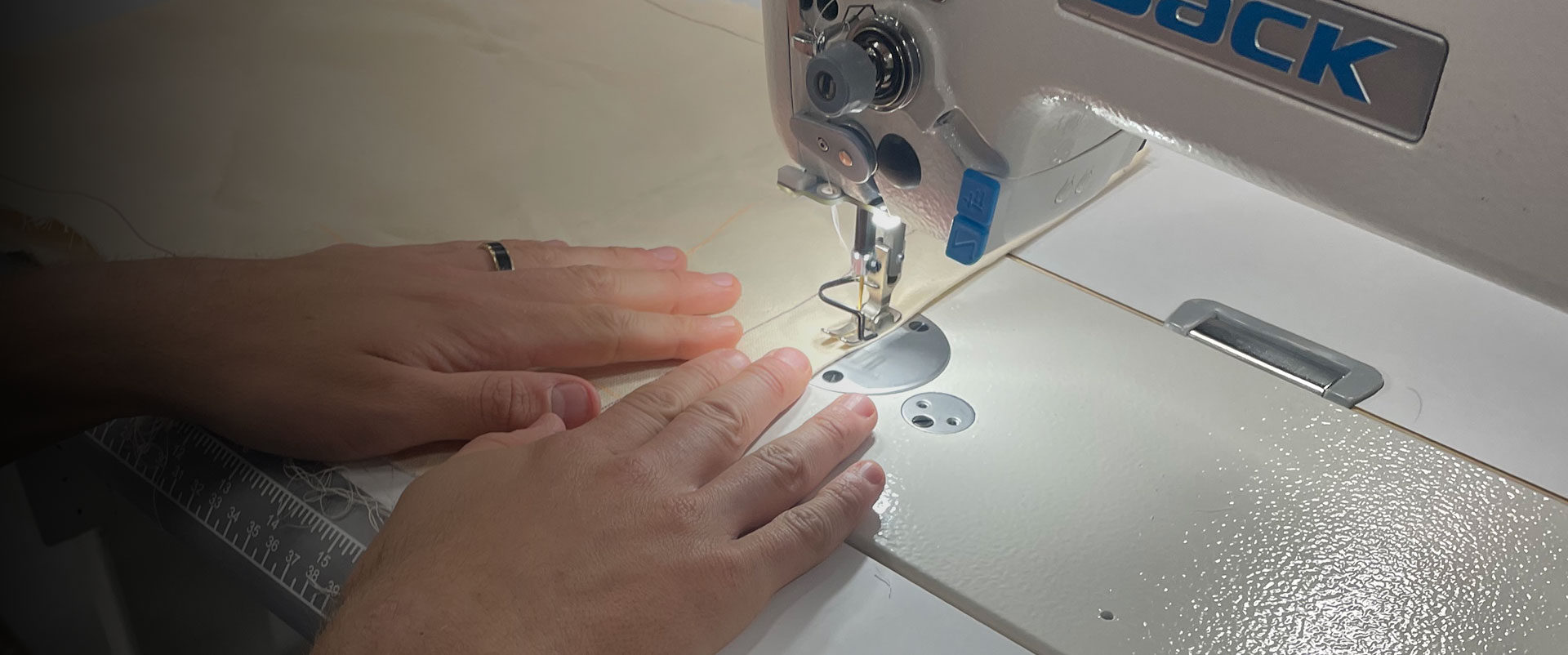 Team member using sewing machine