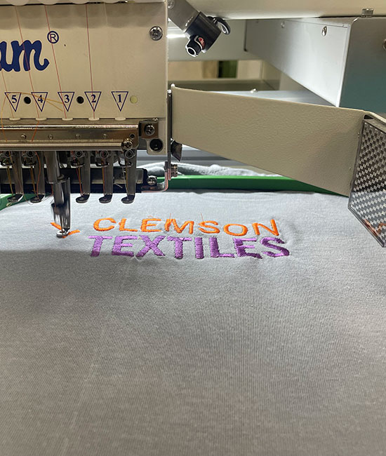 Clemson Textiles logo being stitched on loom