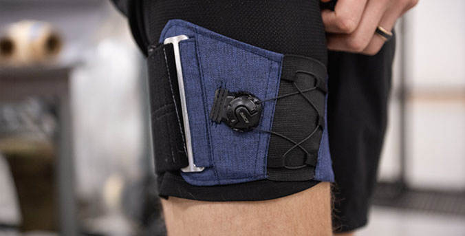 Thigh cuff wrapped around gentleman's thigh