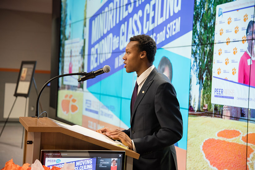Student at podium in the Watt Center