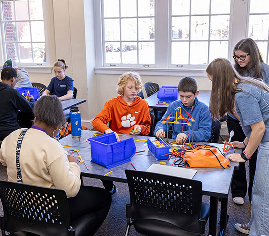 Group of participants in class working on project 
