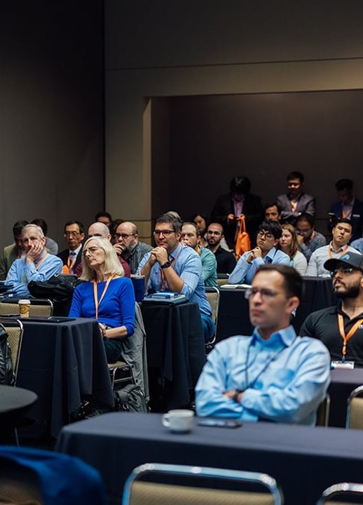 Audience listens during a conference session.