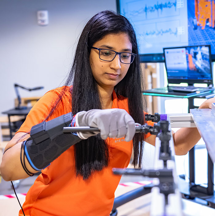 Student with computer-connected glove