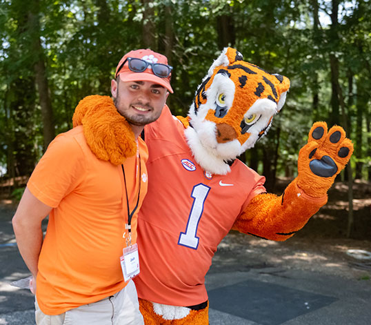 Student at basecamp with tiger mascot