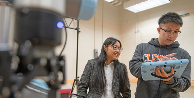 Faculty and student working on project