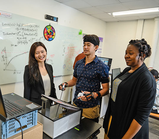 Student in lab with faculty focusing on human factors and ergonomics in the operating room environement.