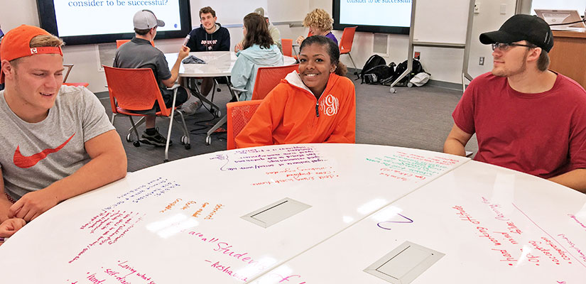 Students working as a group, brainstorming on the table