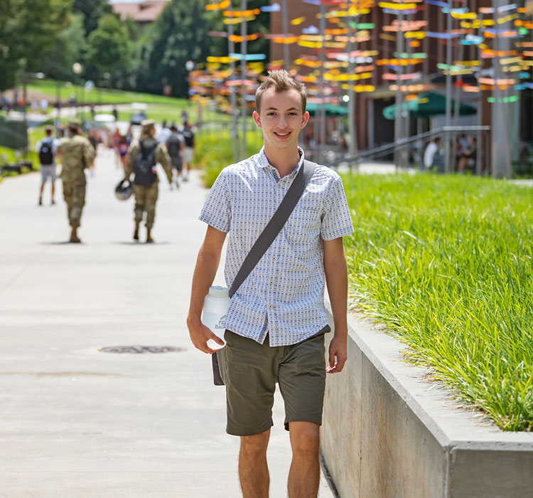 Student walking near McAlister hall