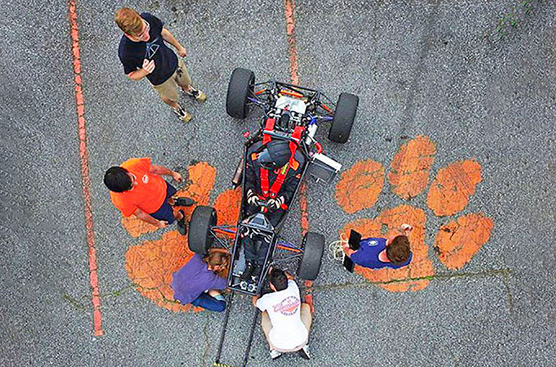 Looking down at SAE car and team