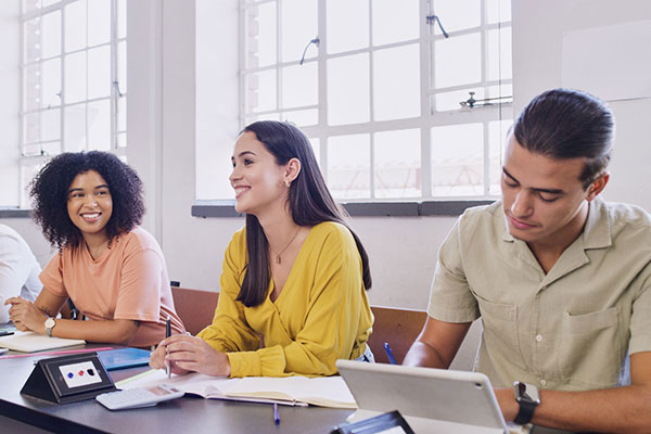 smiling students at table