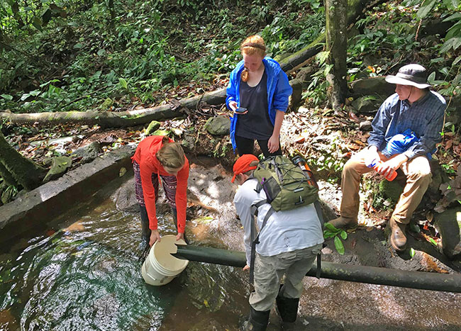 Students in Nicaragua working in stream