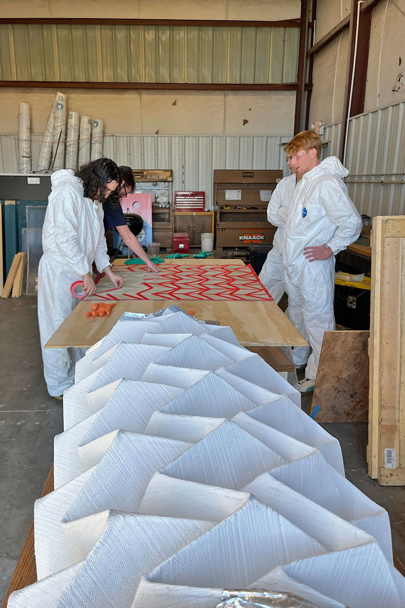 HERD Origami project with students surrounding fluted design