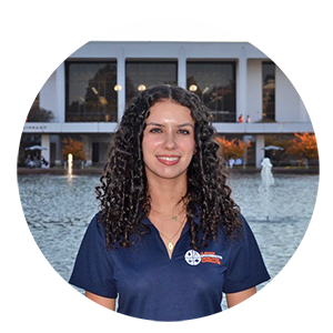 Vanessa Lembi standing in front of Library pool