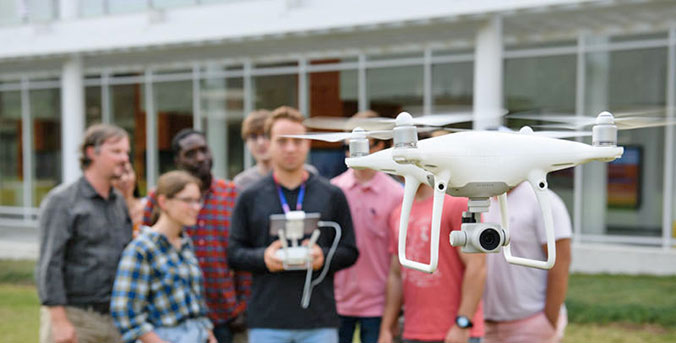 Group working on drone.