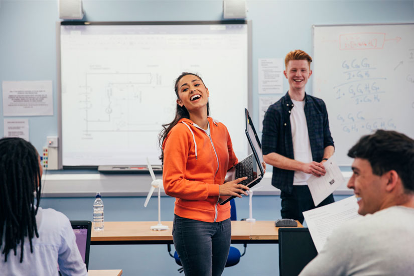 Students in class laughing