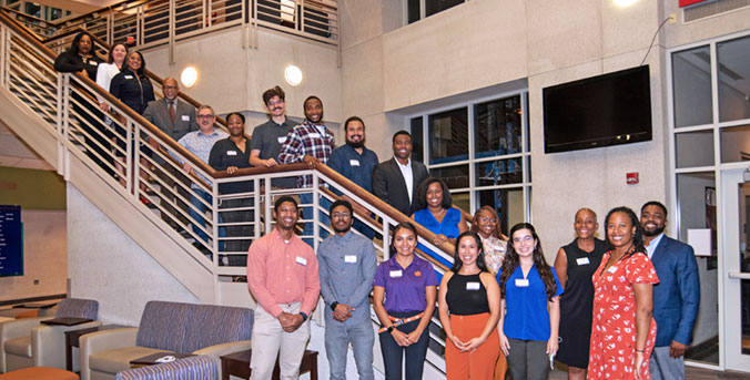 Scholars on stairs in Hendricks Center