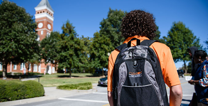 Male with Tiger Alliance backpack