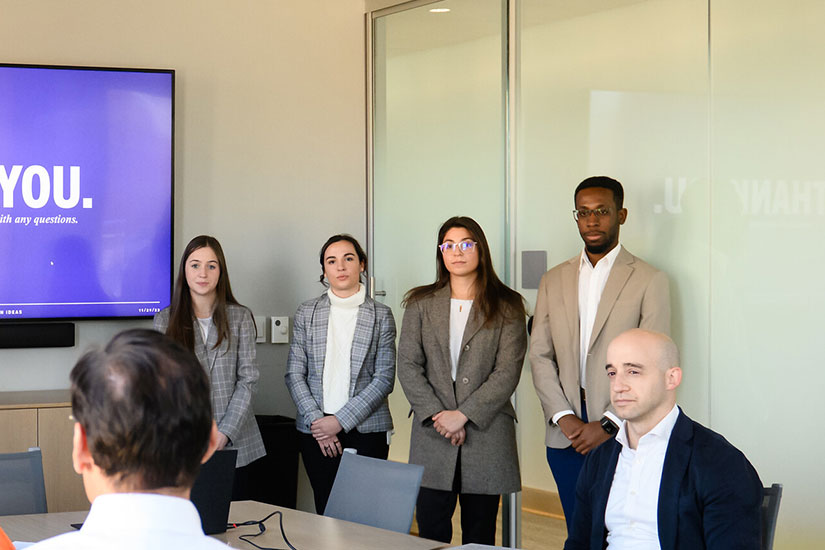 Students giving presentation in front of others