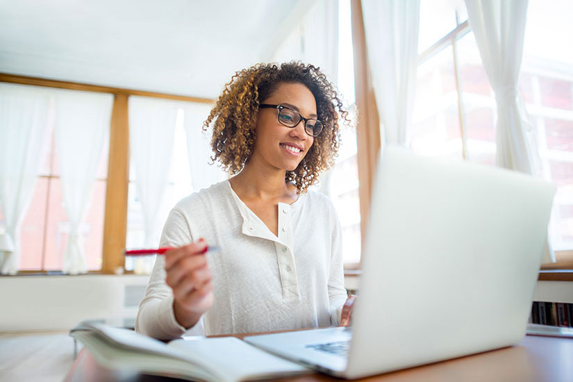 Female at table with laptop