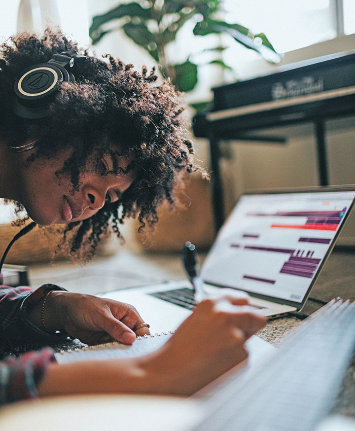 Female student studying on laptop