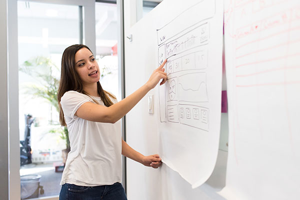 Female student working on board