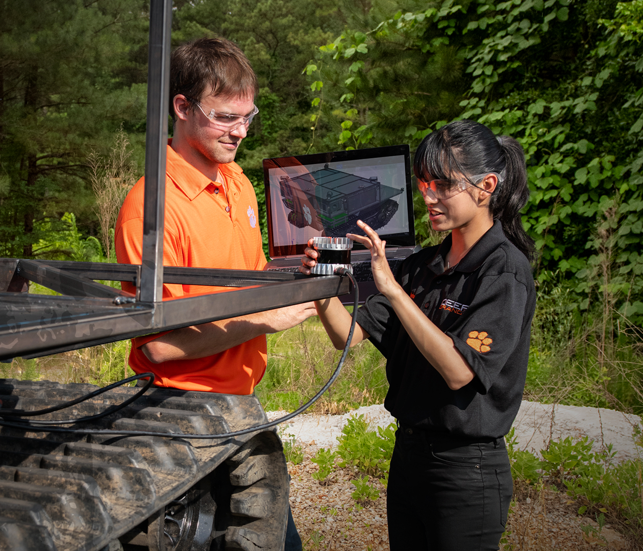 Students actively working on tracked vehicle