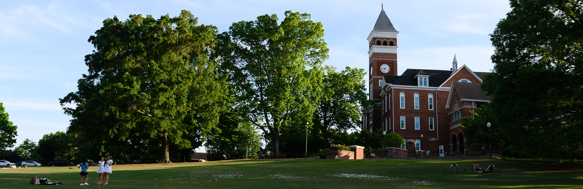 Campus building grounds with students.