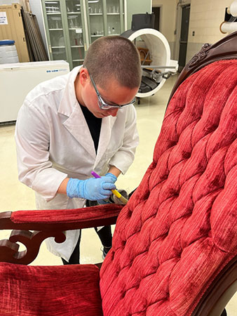 Work restoring red tufted chair