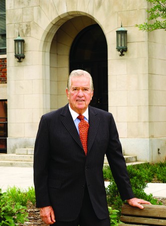 Arthur Spiro stands in front of a building.