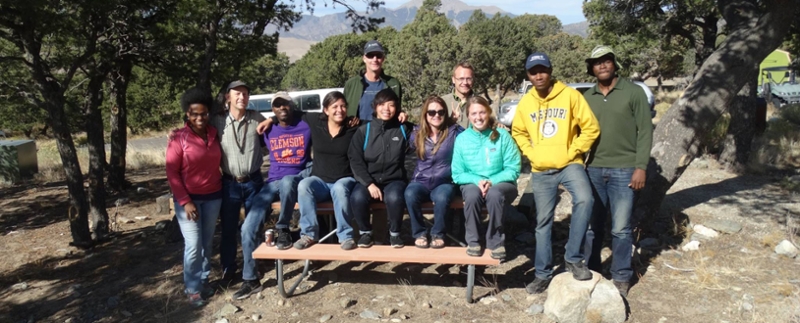 Clemson students on a bench in a national park