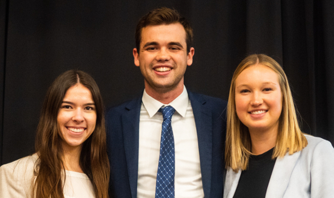 Three students posing for picture