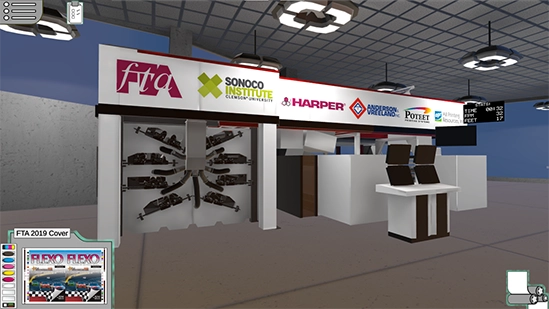 Virtual trade show booth with sponsor logos on a banner, printing equipment on display, and a workstation with multiple monitors.