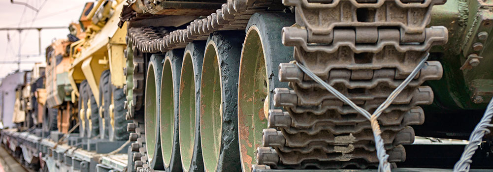 Military vehicles on train