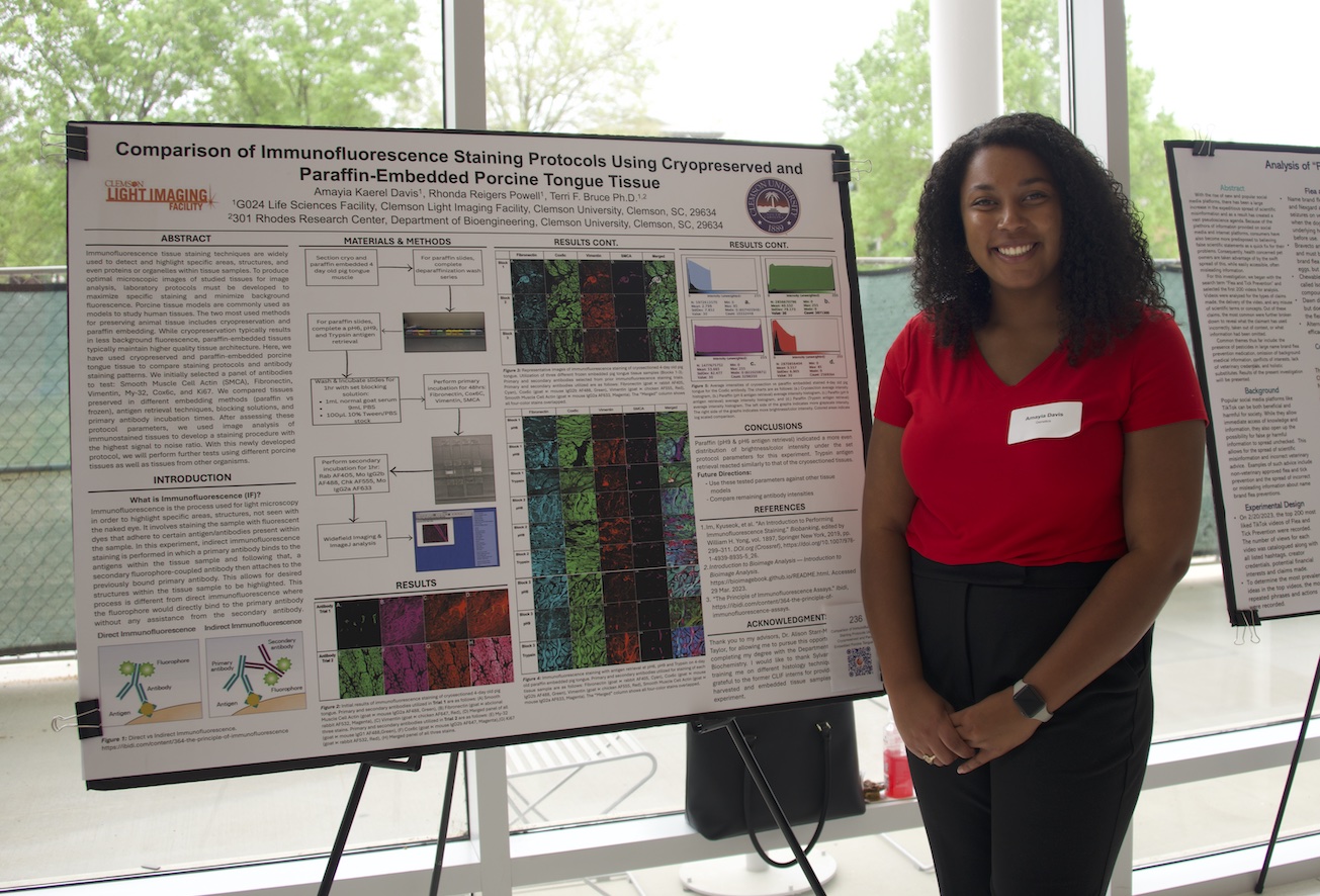 Student presenting a poster