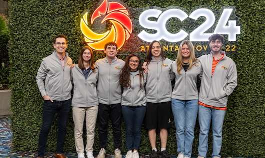 Dr. Jon Calhoun, Kristen Guernsey, Benjamin Schlueter, Ainara Garcia, Samuel Quan, Chloe Crozier and Marcus McAbee at the Student Cluster Competition at Super Computing