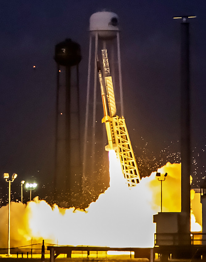 Lily Dickinson, Anna Koger and Hailey Herzog meet with executives at SKIM Research. 