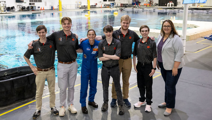 : CI students at the Micro-g competition. L to R: Smith Juback, Andrew Densieski, astronaut Nicole “Duke” Mann, Keller Hawkins, Ryan de Jager, Ryan Rutulo and Flight Director Rebecca Wingfield.